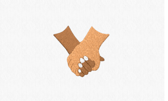 Why Clasped Hands Embroidery Resonates on Boutique Apparel